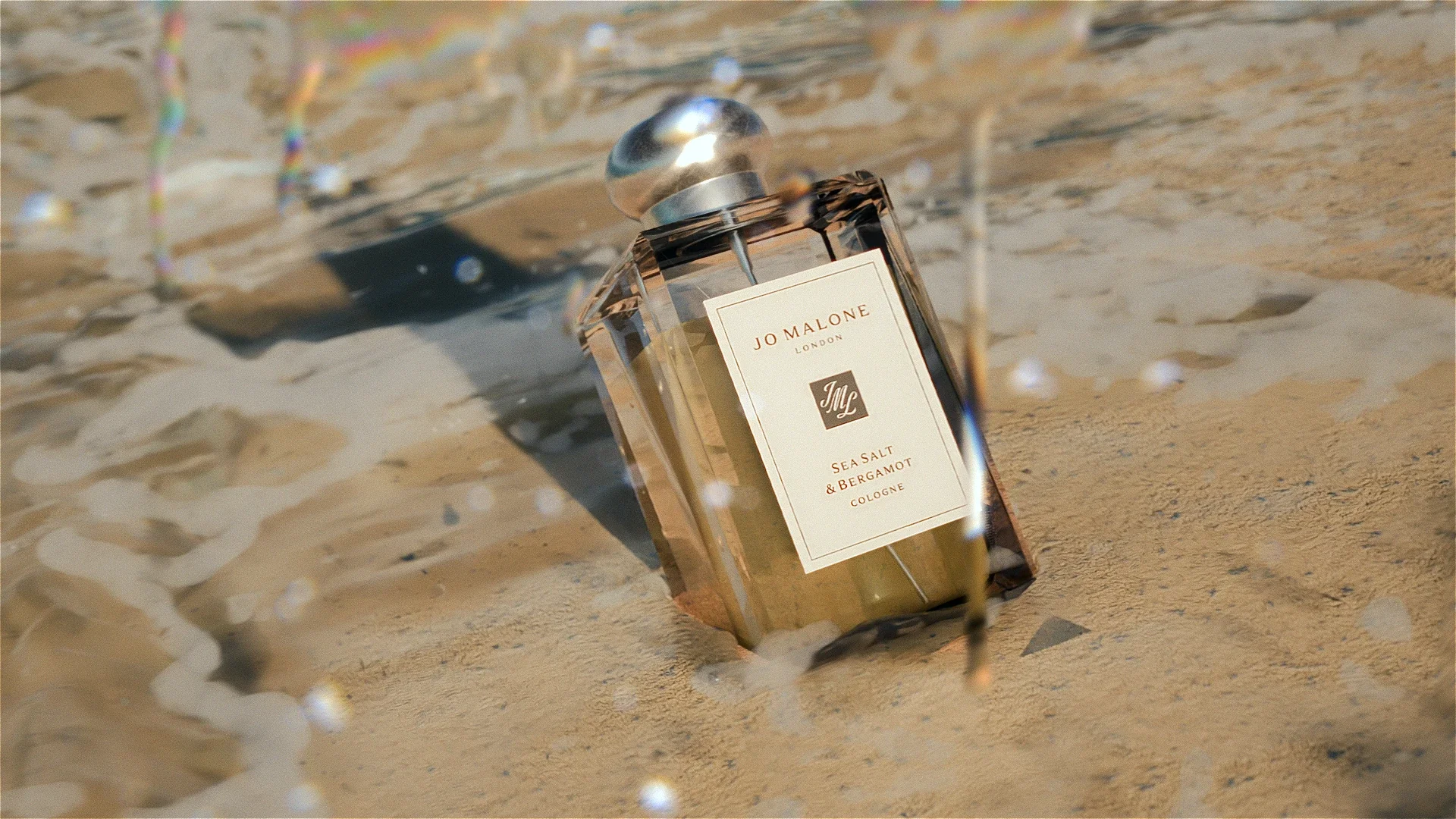 Cinematic product shot of Jo Malone London Sea Salt and Bergamot on sunlit sand